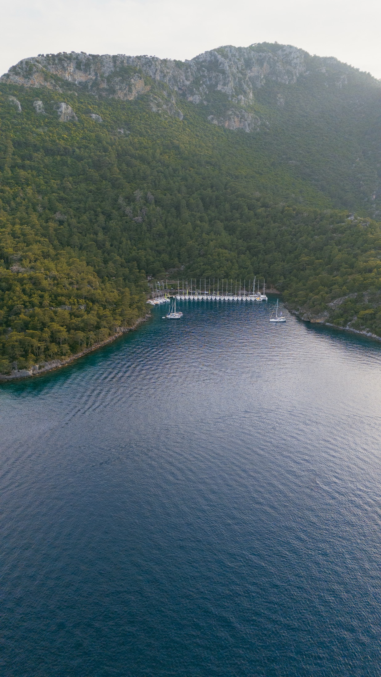 Yachts moored in a protected Mediterranean bay